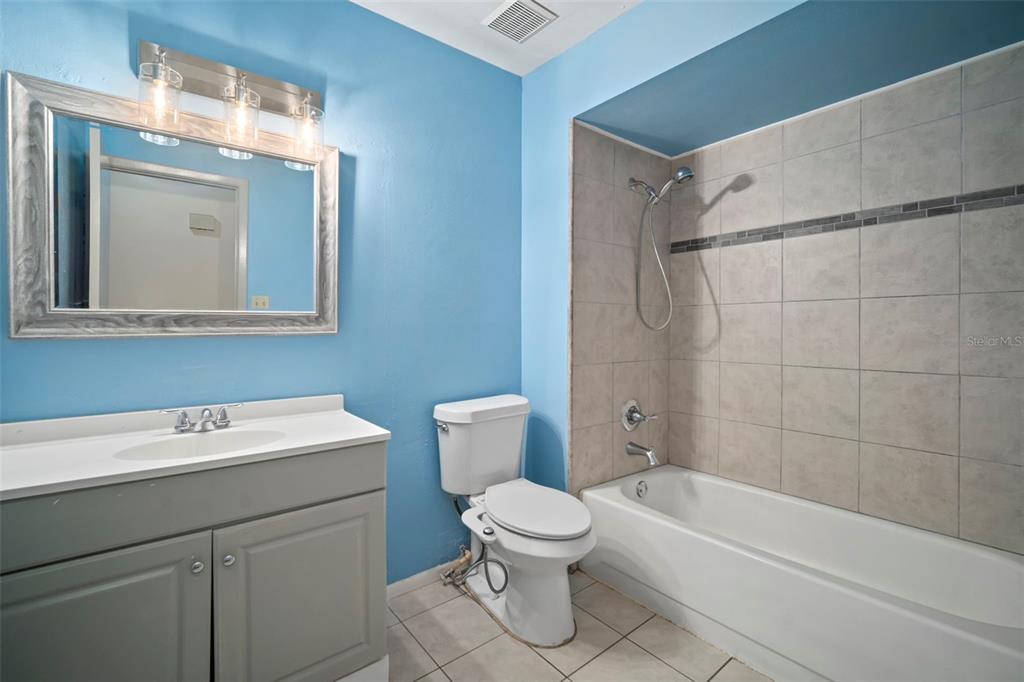 810 Black Knight Drive Valrico, FL 33594 - Photo 27 of 44 a bathroom with a sink a toilet and shower