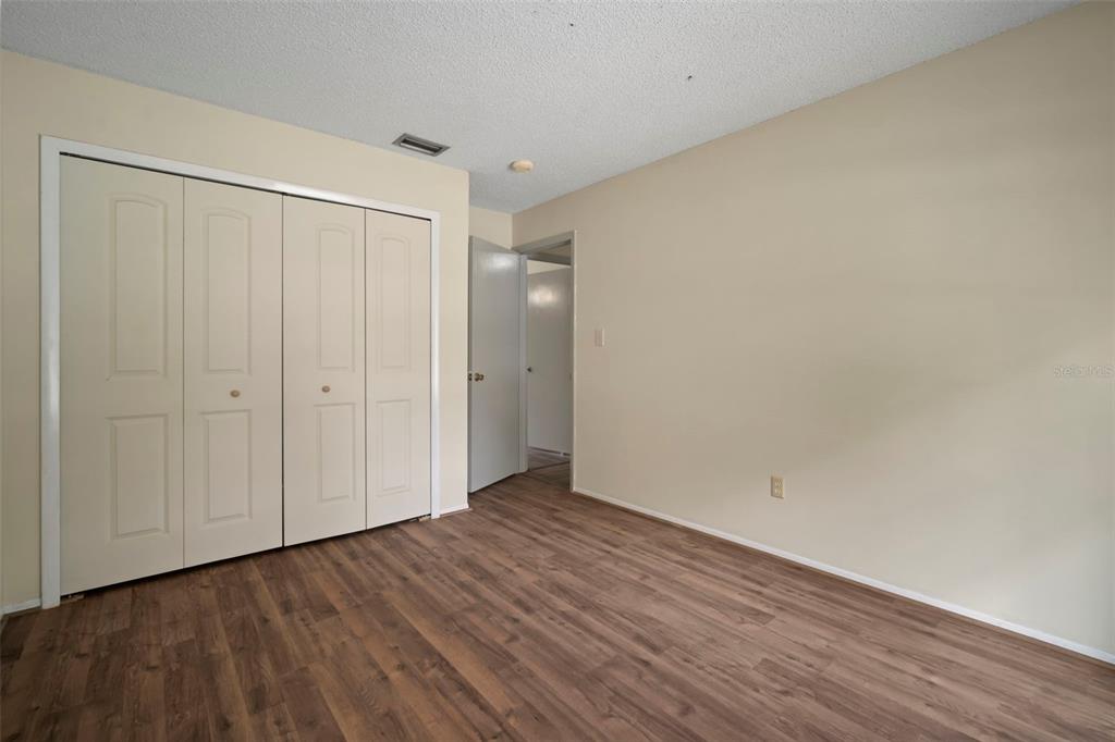 810 Black Knight Drive Valrico, FL 33594 - Photo 29 of 44 a view of an empty room with wooden floor