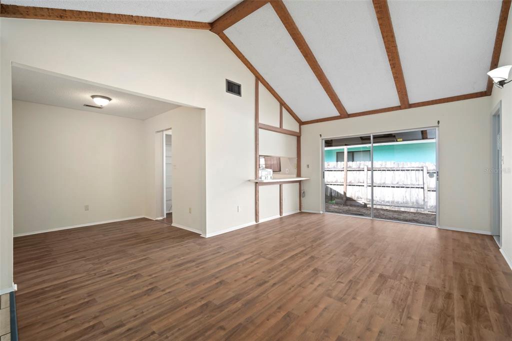 810 Black Knight Drive Valrico, FL 33594 - Photo 3 of 44 a view of empty room with wooden floor and fan