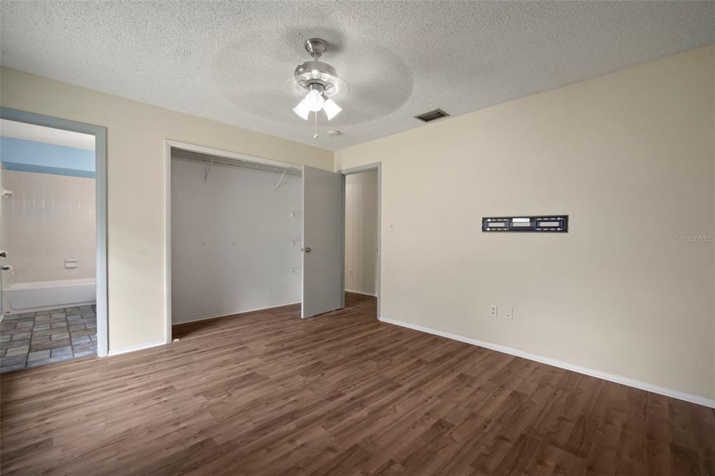 810 Black Knight Drive Valrico, FL 33594 - Photo 32 of 44 a view of an empty room with wooden floor