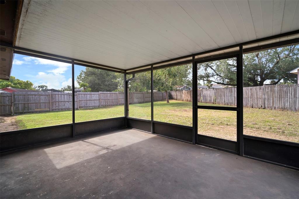 810 Black Knight Drive Valrico, FL 33594 - Photo 35 of 44 a view of an empty room with a floor to ceiling window