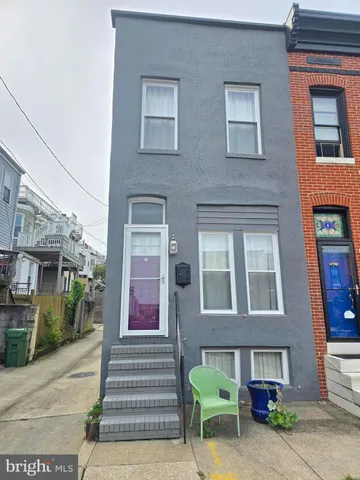 a view of a brick building with many windows