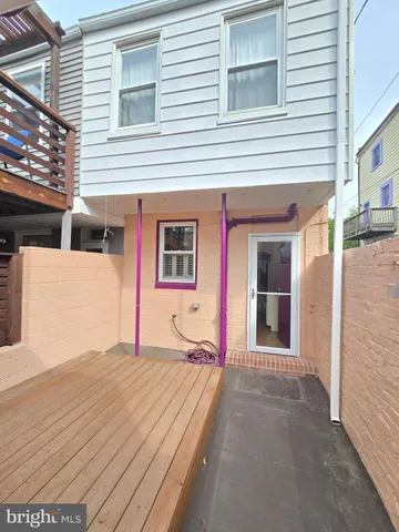 a front view of a house with a road