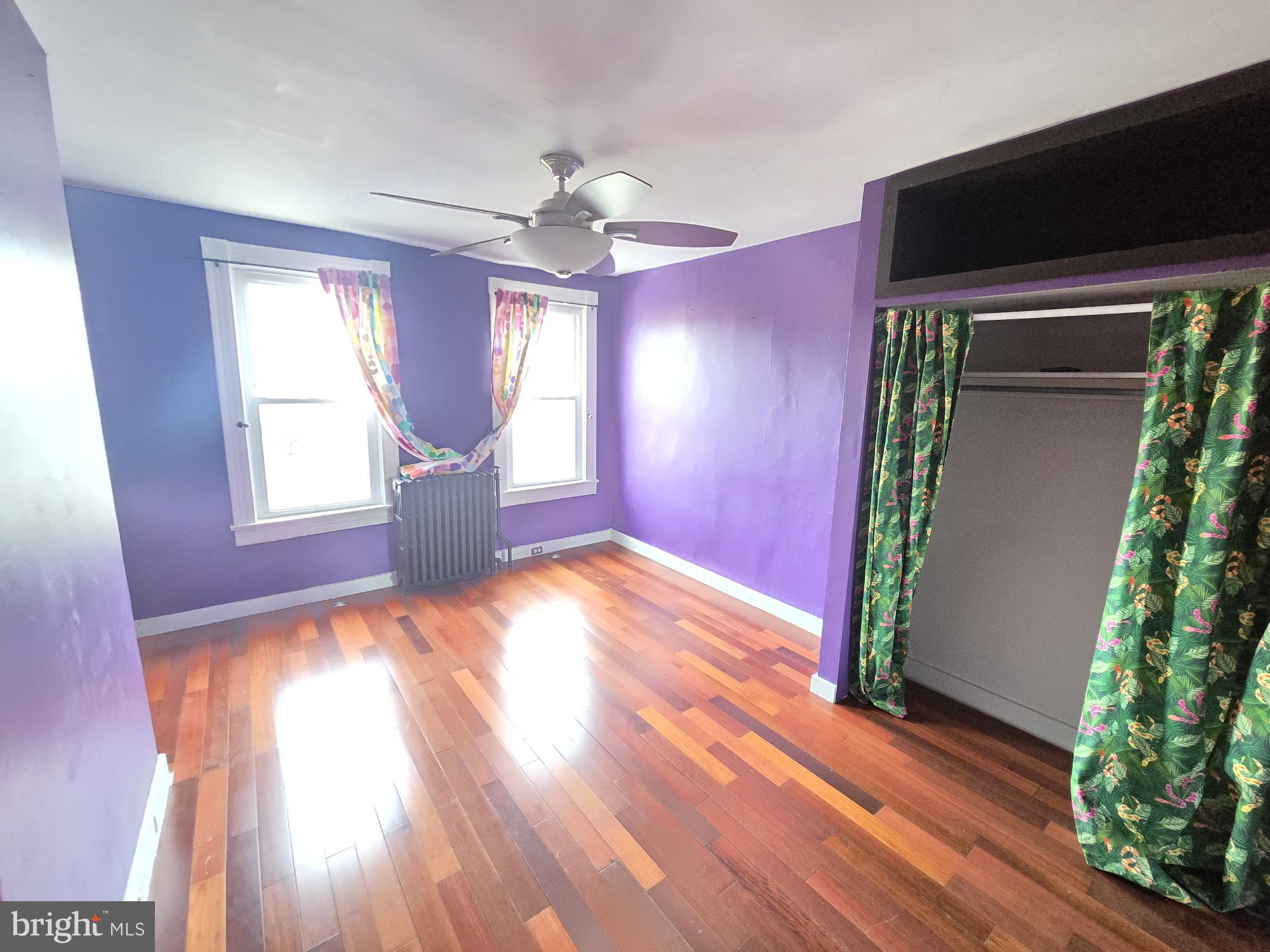 2 North Luzerne Avenue Baltimore, MD 21224 - Photo 16 of 31 an empty room with wooden floor and windows