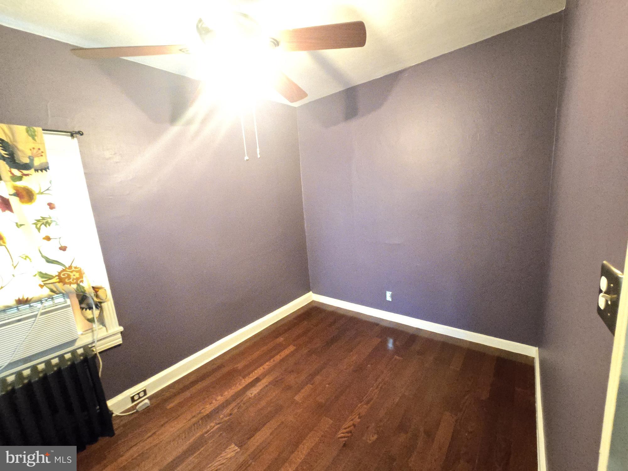 2 North Luzerne Avenue Baltimore, MD 21224 - Photo 19 of 31 a view of empty room with wooden floor