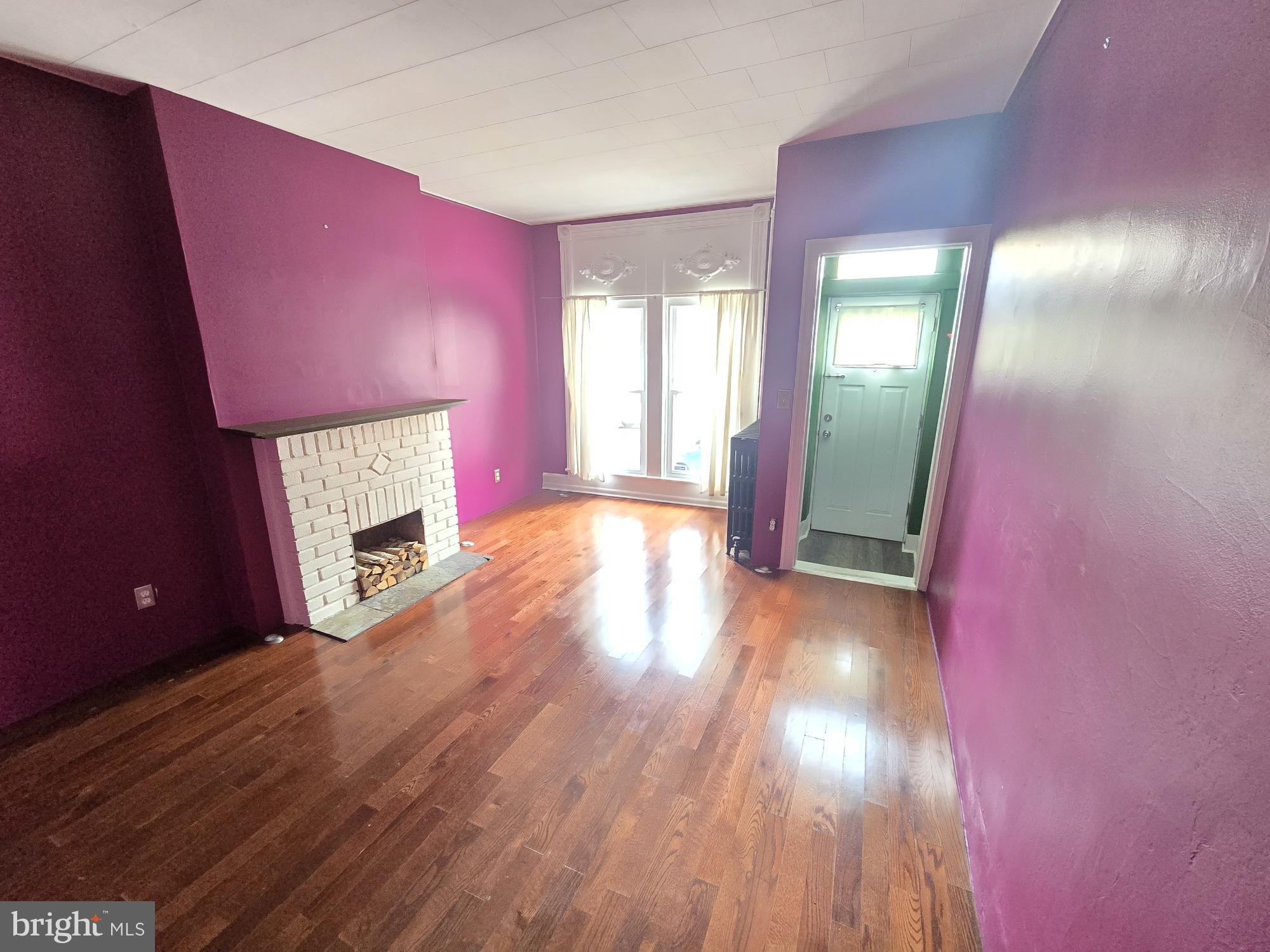2 North Luzerne Avenue Baltimore, MD 21224 - Photo 2 of 31 a view of empty room with wooden floor
