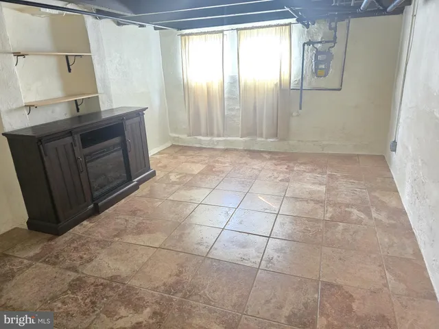 a front view of a house with a road