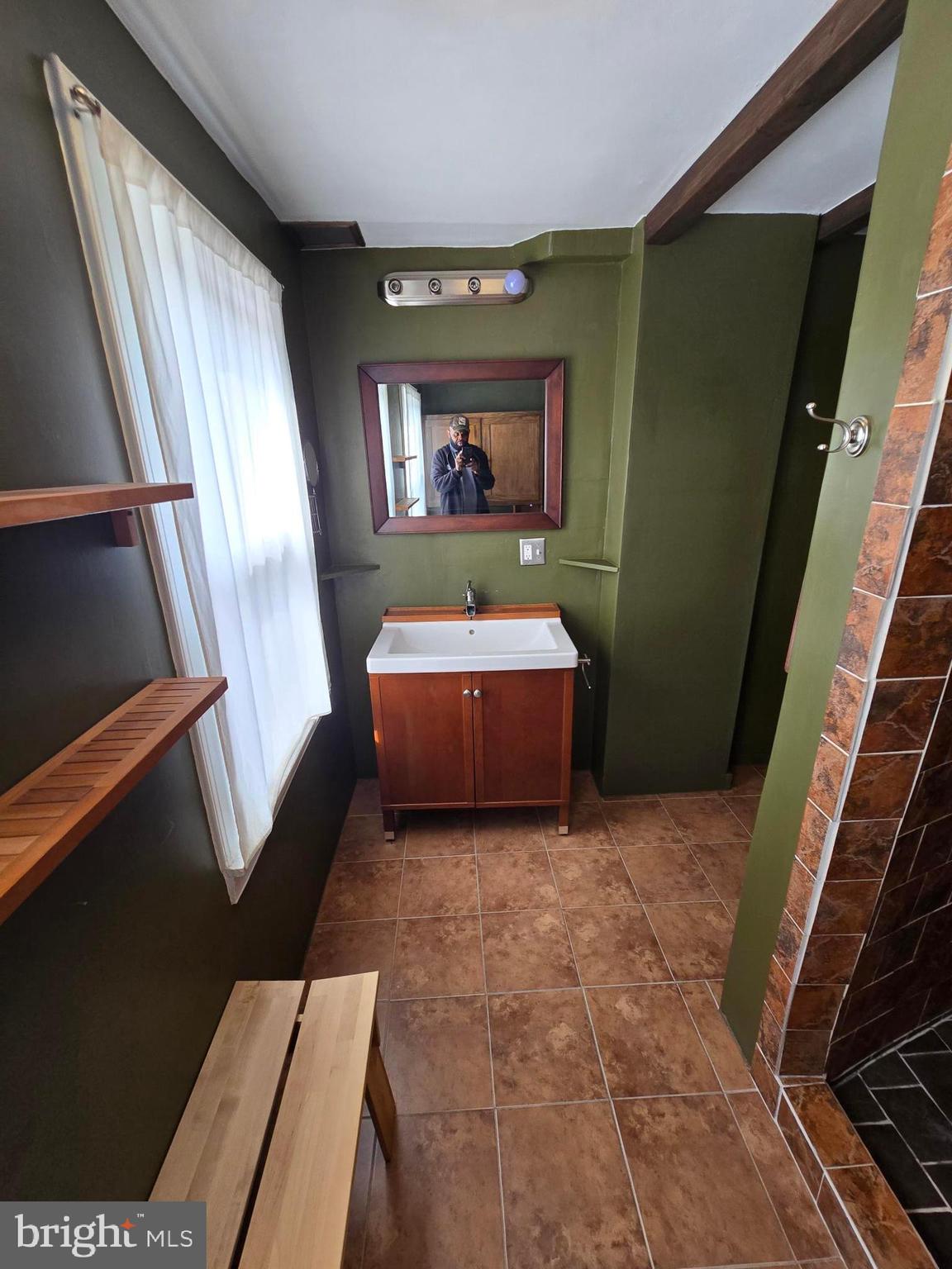 2 North Luzerne Avenue Baltimore, MD 21224 - Photo 26 of 31 a living room with furniture and a mirror