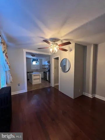 a view of a livingroom with wooden floor