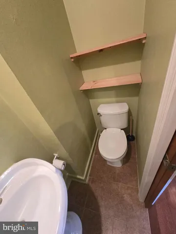 a bathroom with a toilet and a sink