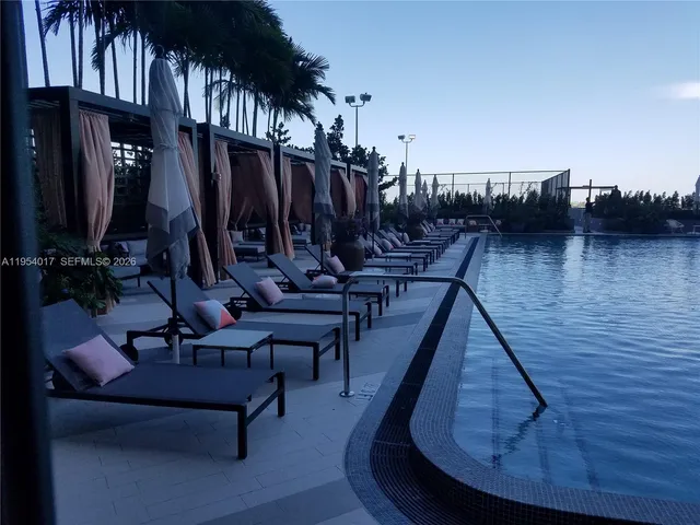 a view of a chairs and tables in the patio