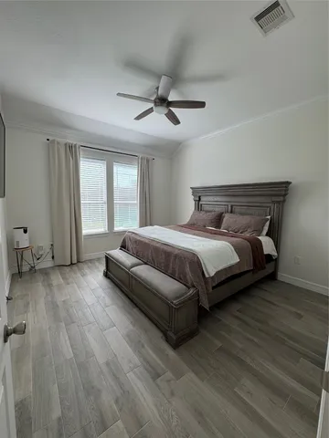 a bedroom with a bed and window