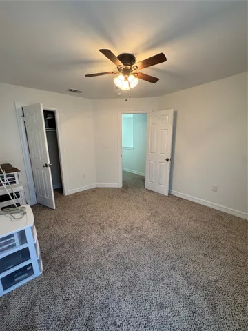 a view of a livingroom with a workspace