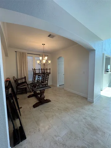 a room with gym equipment and a large window