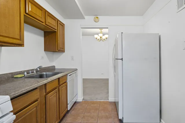 a bathroom with a granite countertop sink a mirror and a vanity