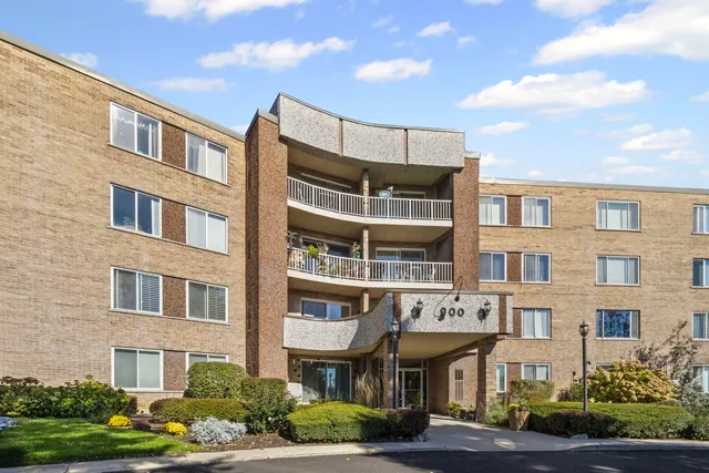 a front view of a building with garden