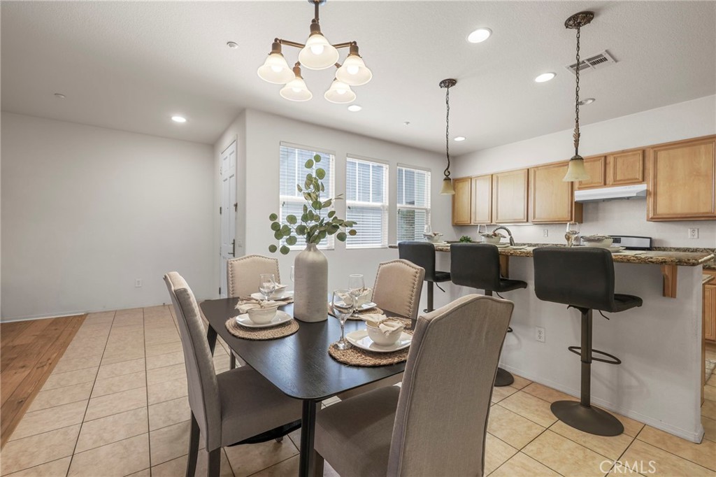 10375 Church, Unit 124 Rancho Cucamonga, CA 91730 - Photo 11 of 34 a view of a dining room with furniture