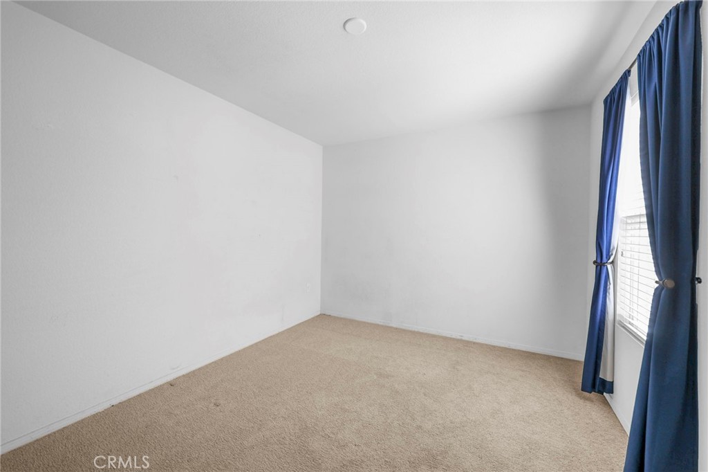 10375 Church, Unit 124 Rancho Cucamonga, CA 91730 - Photo 18 of 34 a view of an empty room and a window