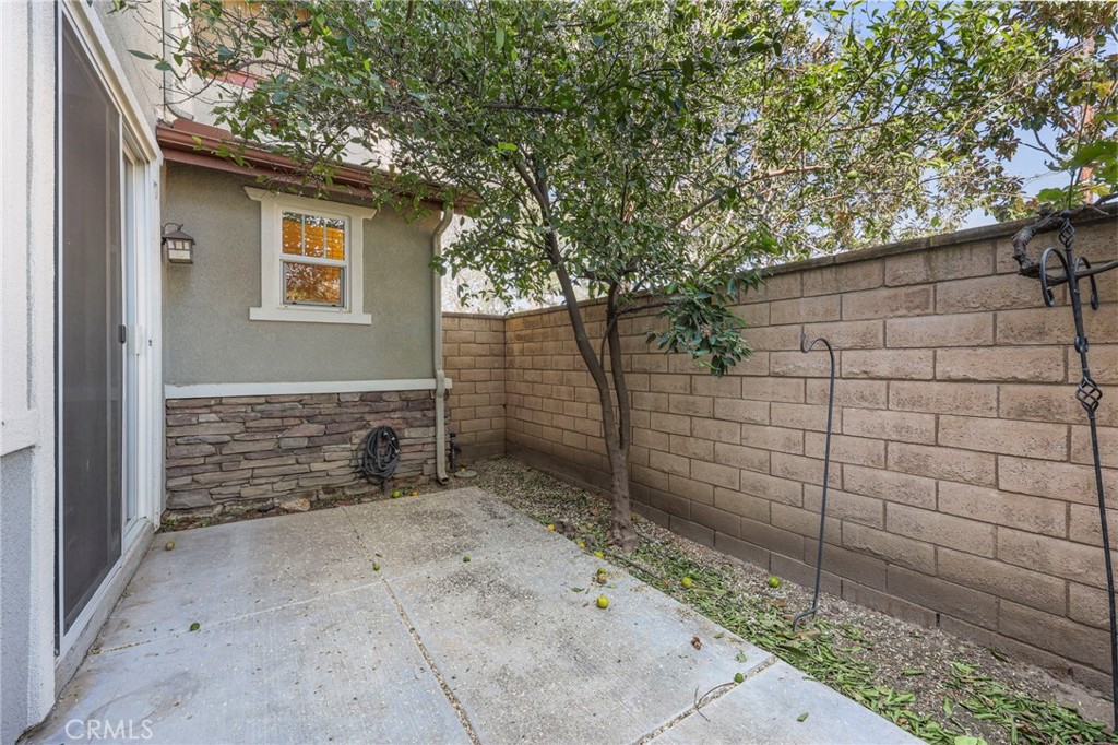 10375 Church, Unit 124 Rancho Cucamonga, CA 91730 - Photo 24 of 34 a view of a pathway of a house with wooden fence