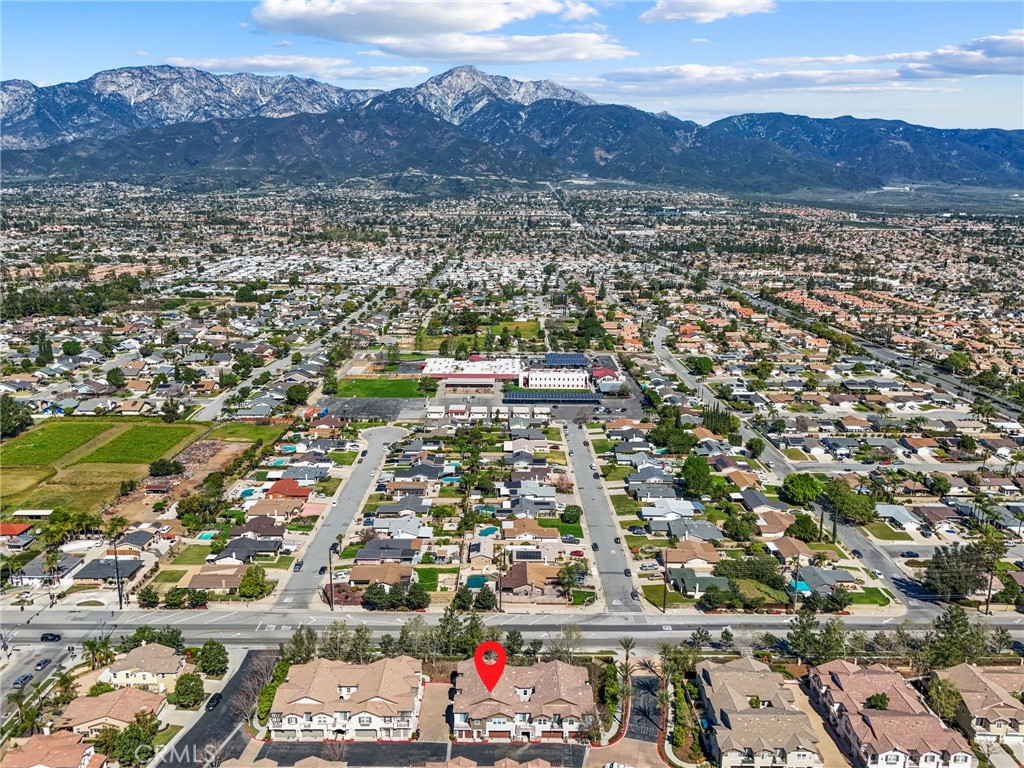 10375 Church, Unit 124 Rancho Cucamonga, CA 91730 - Photo 32 of 34 an aerial view of residential houses and outdoor space