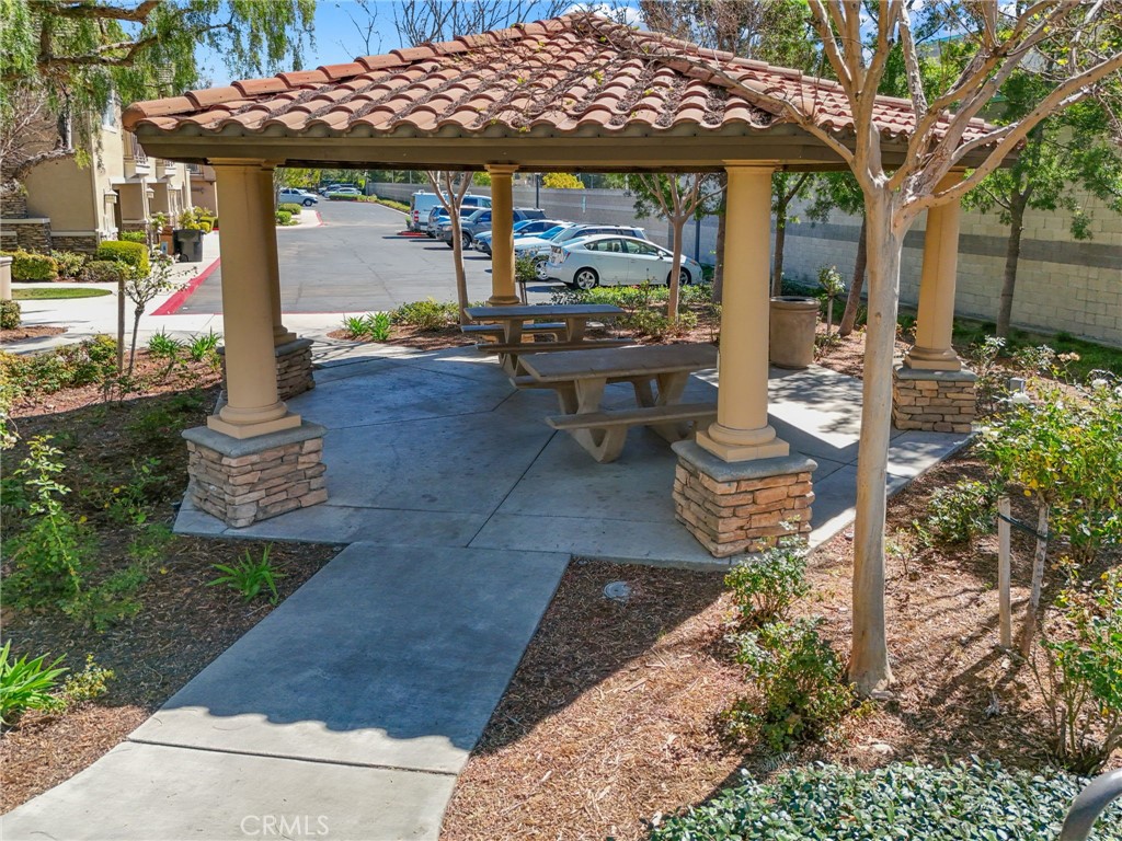 10375 Church, Unit 124 Rancho Cucamonga, CA 91730 - Photo 34 of 34 a front view of a house with garden
