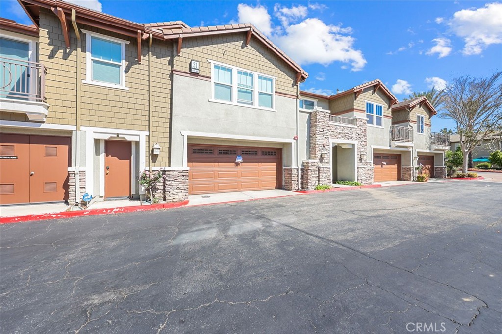 10375 Church, Unit 124 Rancho Cucamonga, CA 91730 - Photo 4 of 34 a view of a house with a street