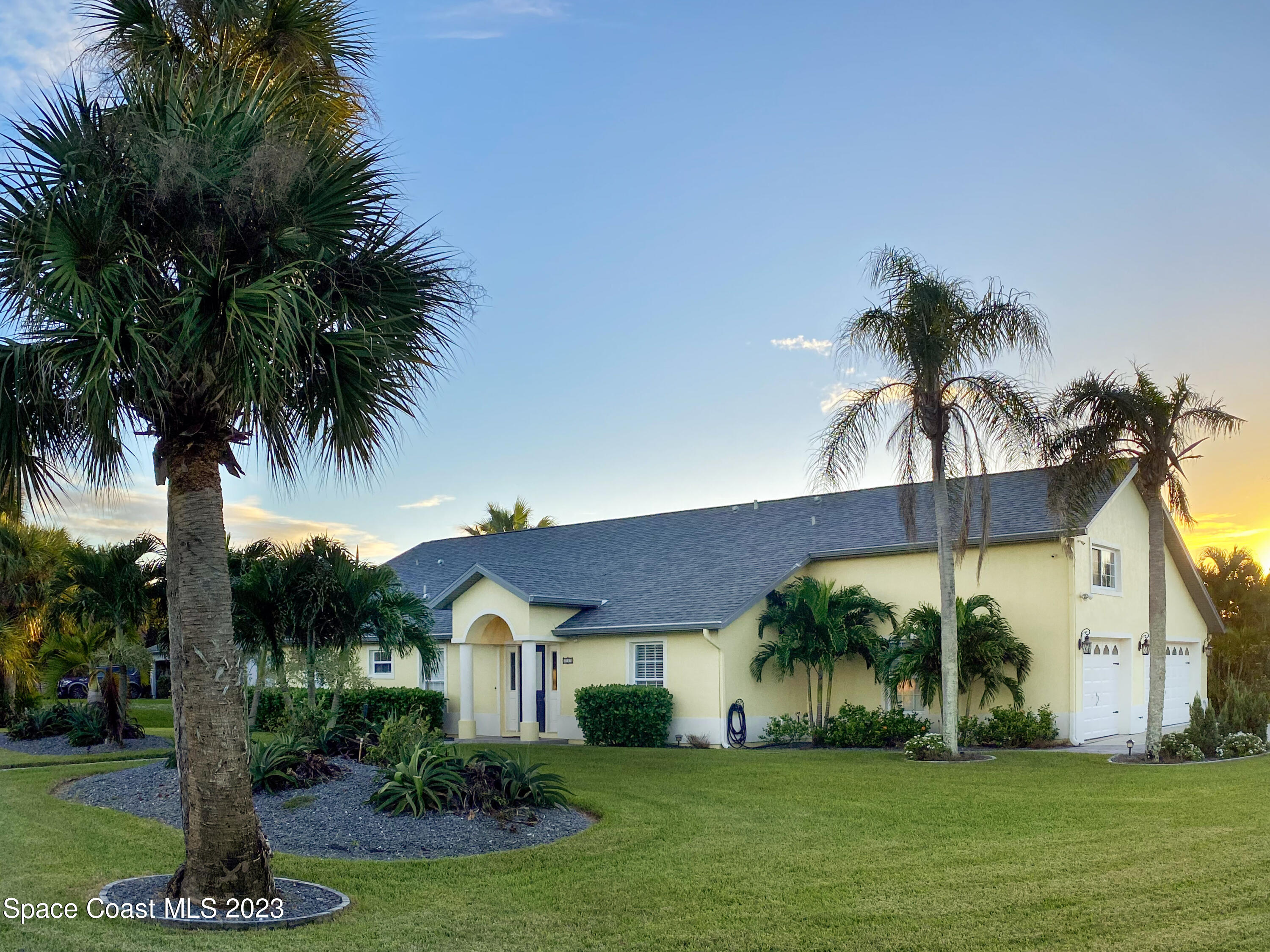 5080 Seiler Street Melbourne Beach, FL 32951 - Photo 1 of 34 a front view of house with yard and green space