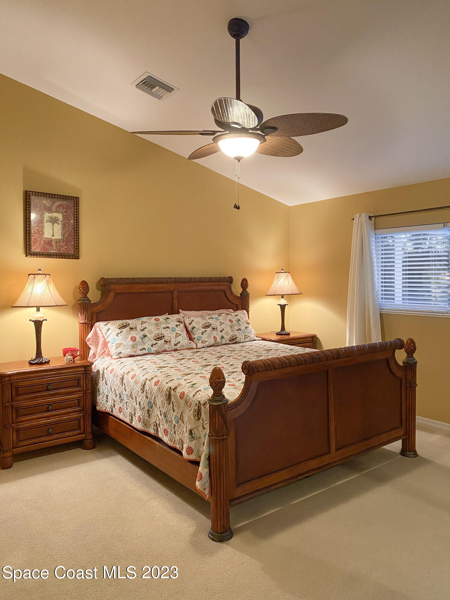 5080 Seiler Street Melbourne Beach, FL 32951 - Photo 15 of 34 a bedroom with a bed and dresser