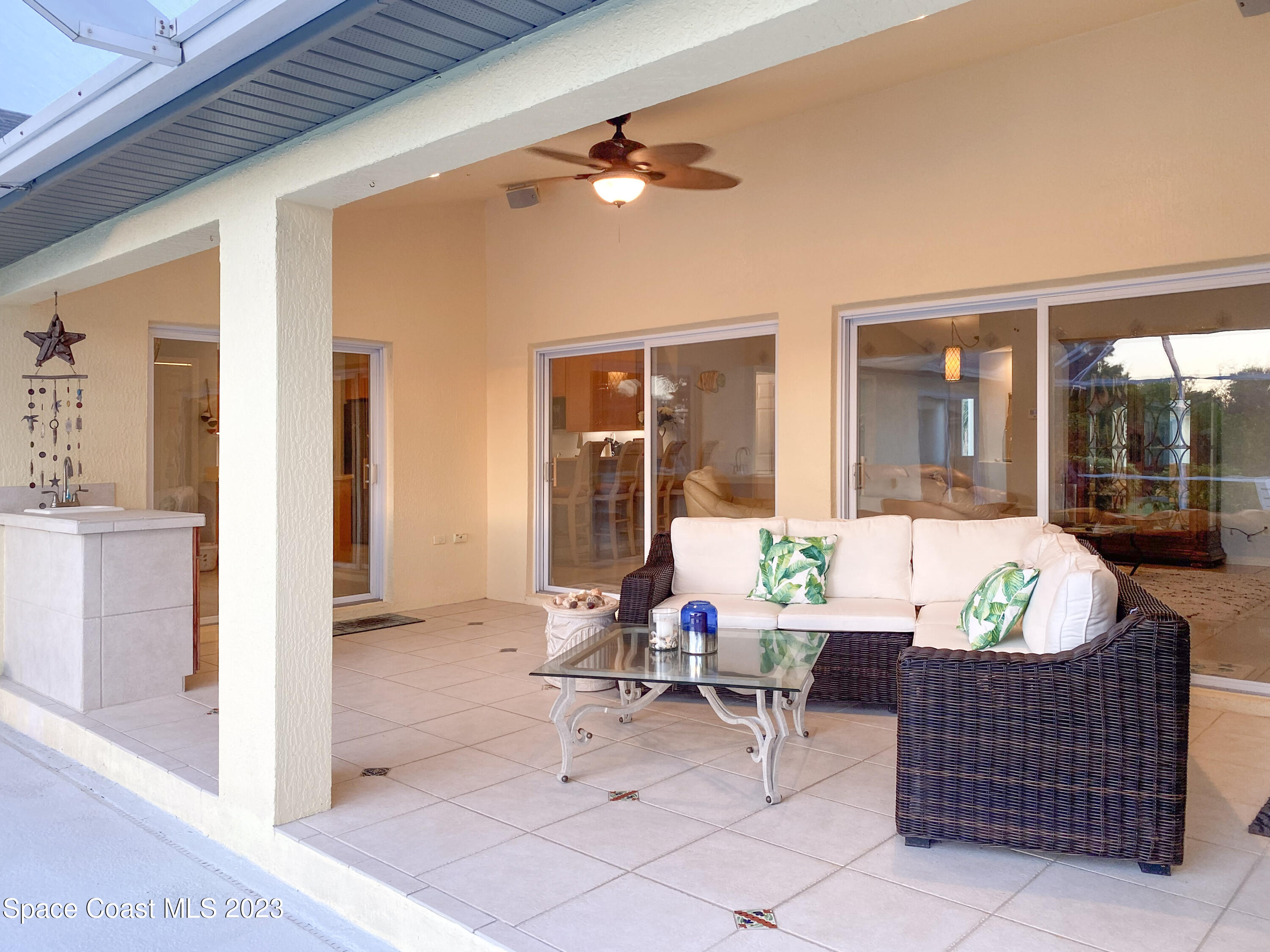 5080 Seiler Street Melbourne Beach, FL 32951 - Photo 24 of 34 a living room with furniture and dining table