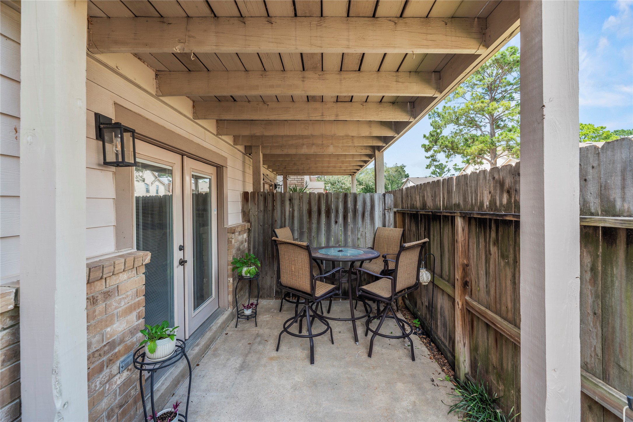 16913 Chapel Pines Drive, Unit 126 Spring, TX 77379 - Photo 27 of 27 This covered patio is perfect for outdoor meals and relaxation.
