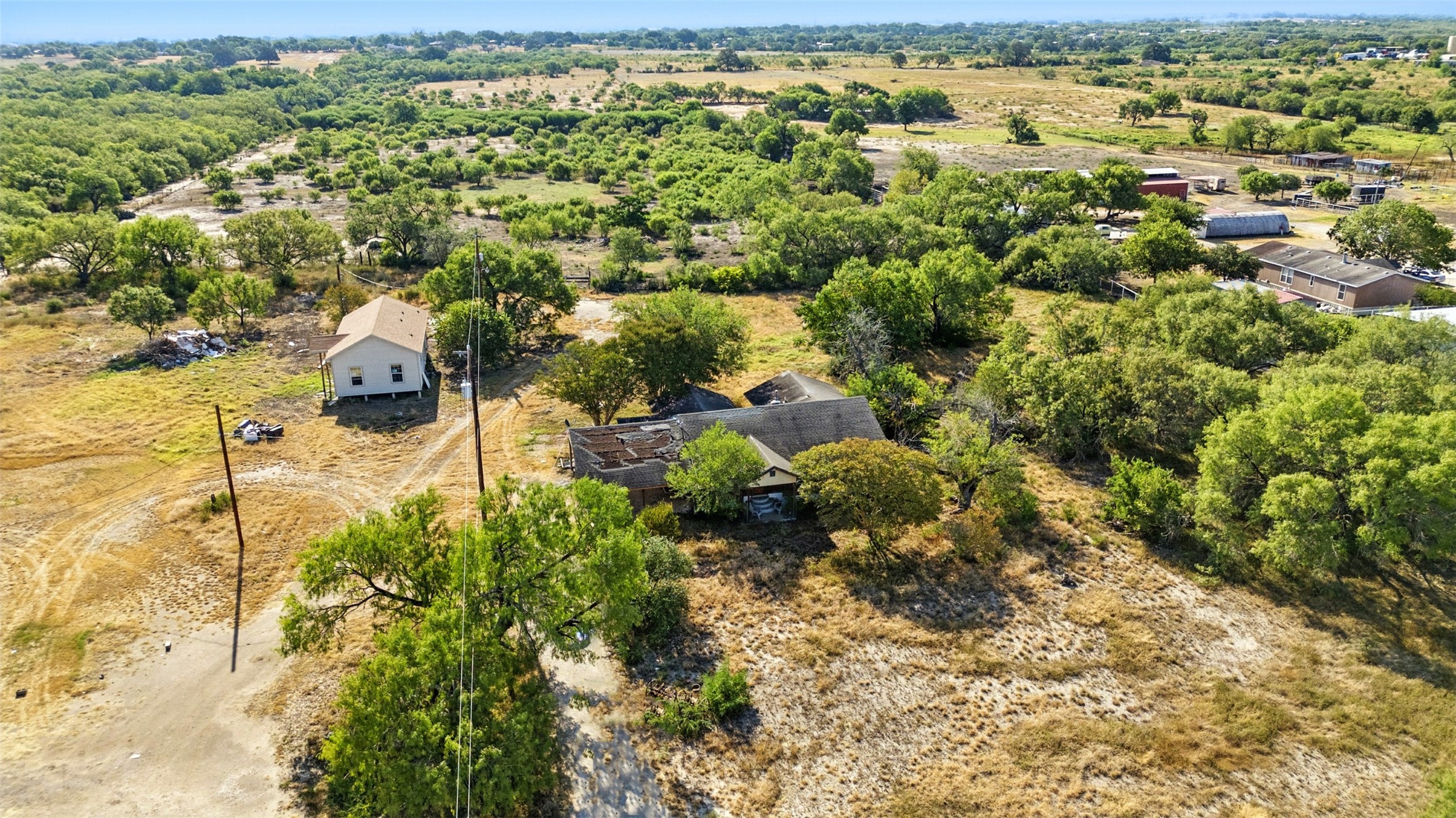 4672 Rakowitz Road Adkins, TX 78101 - Photo 19 of 38 An elevated perspective reveals the property’s natural setting, framed by greenery and open skies.