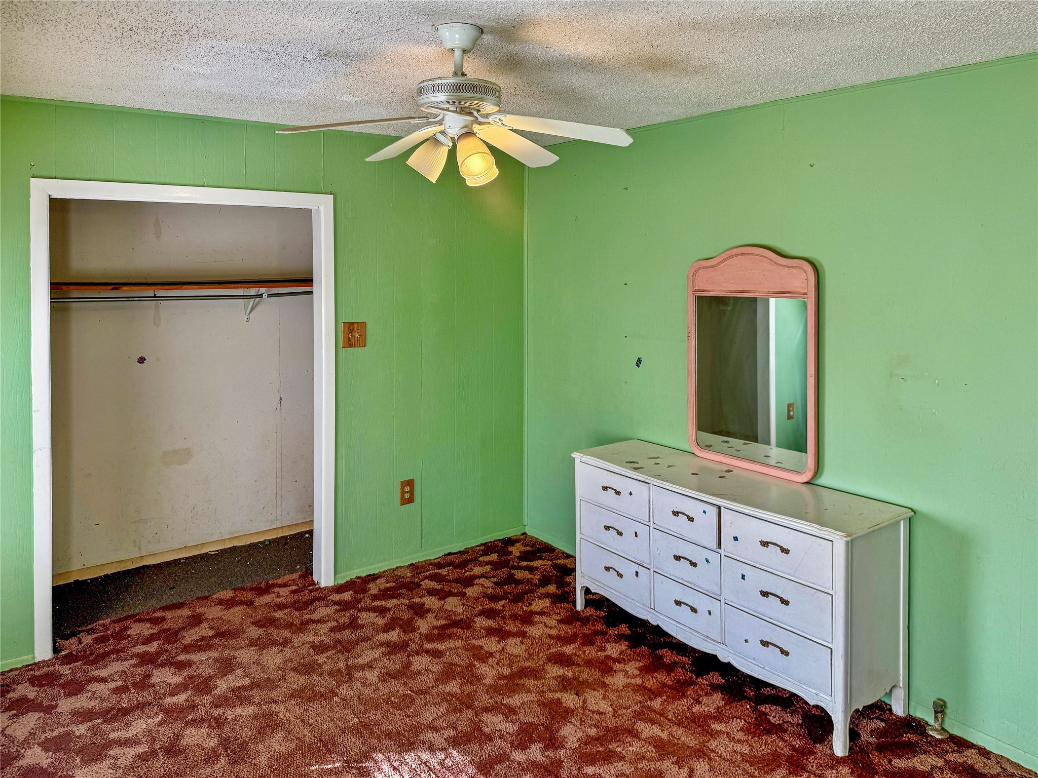 4672 Rakowitz Road Adkins, TX 78101 - Photo 21 of 38 a bedroom with a bed and a dresser