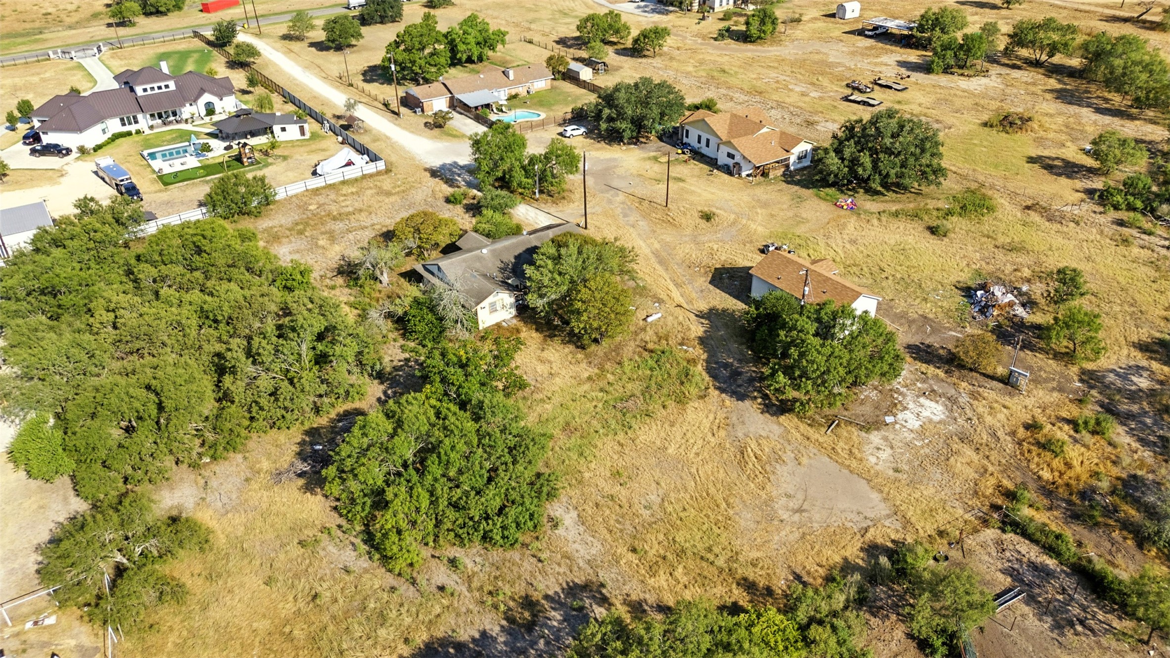 4672 Rakowitz Road Adkins, TX 78101 - Photo 36 of 38 a view of a yard with trees
