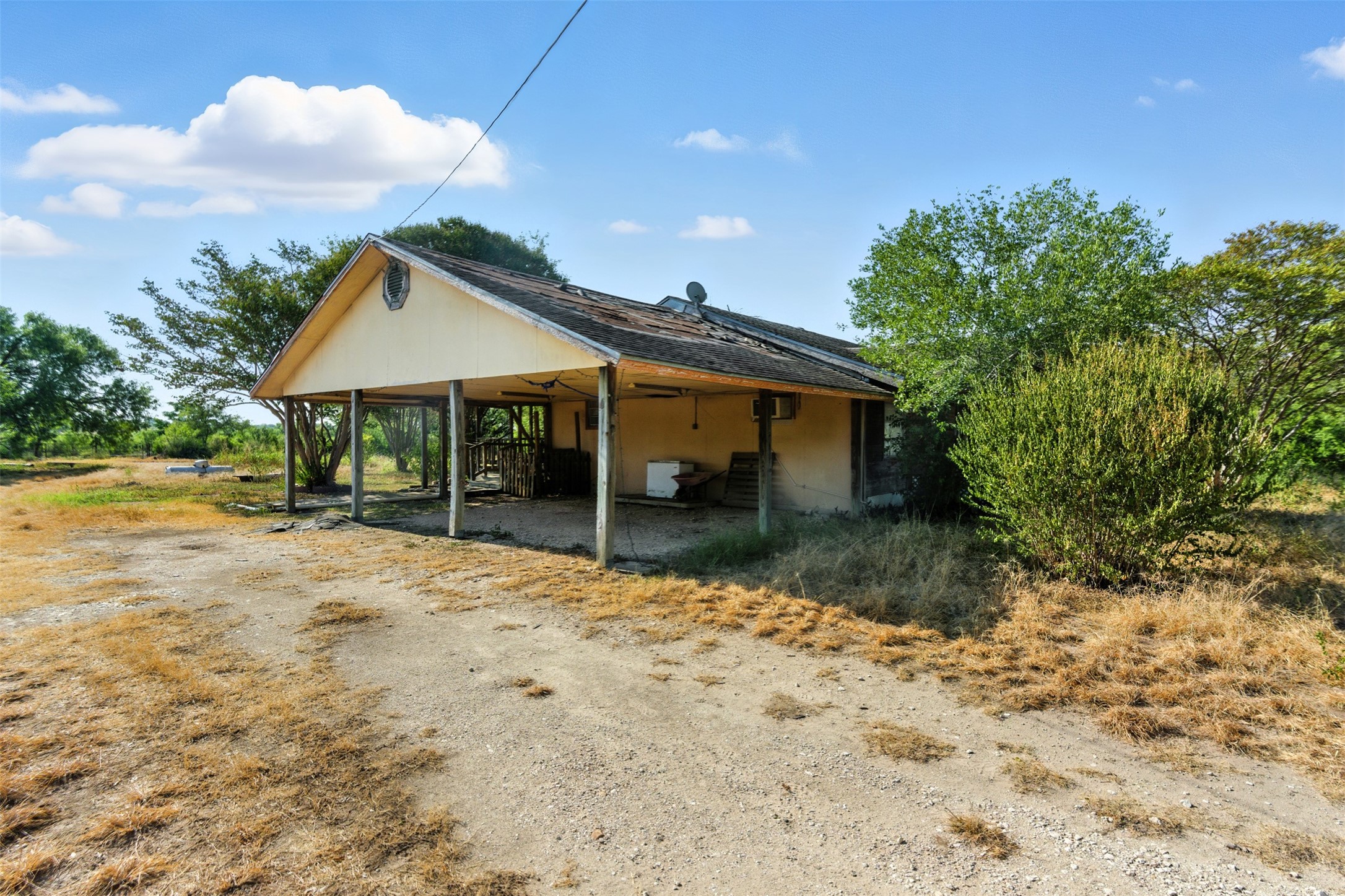 4672 Rakowitz Road Adkins, TX 78101 - Photo 5 of 38 a front view of a house with a yard and porch