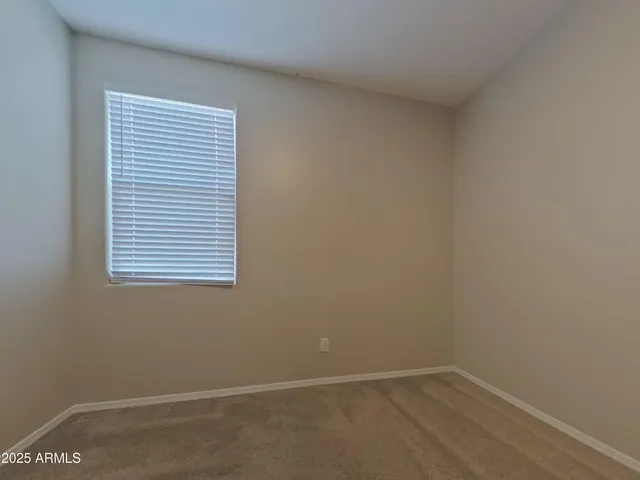 an empty room with a empty space and a window