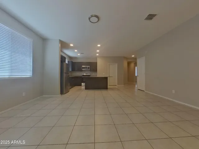 an empty room with a empty space and window