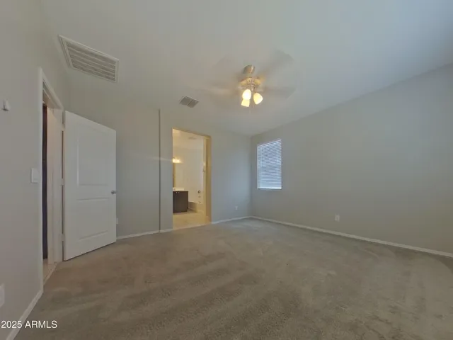 a big room with chandelier and window