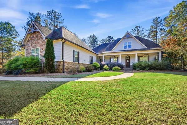 a front view of a house with a yard