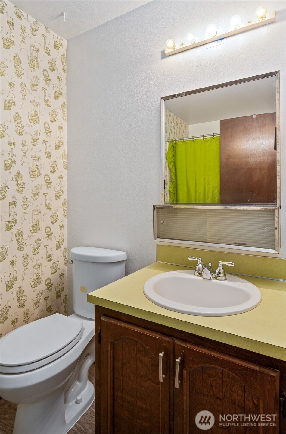 14606 60th Place West Edmonds, WA 98026 - Photo 13 of 27 a bathroom with a sink a toilet and mirror