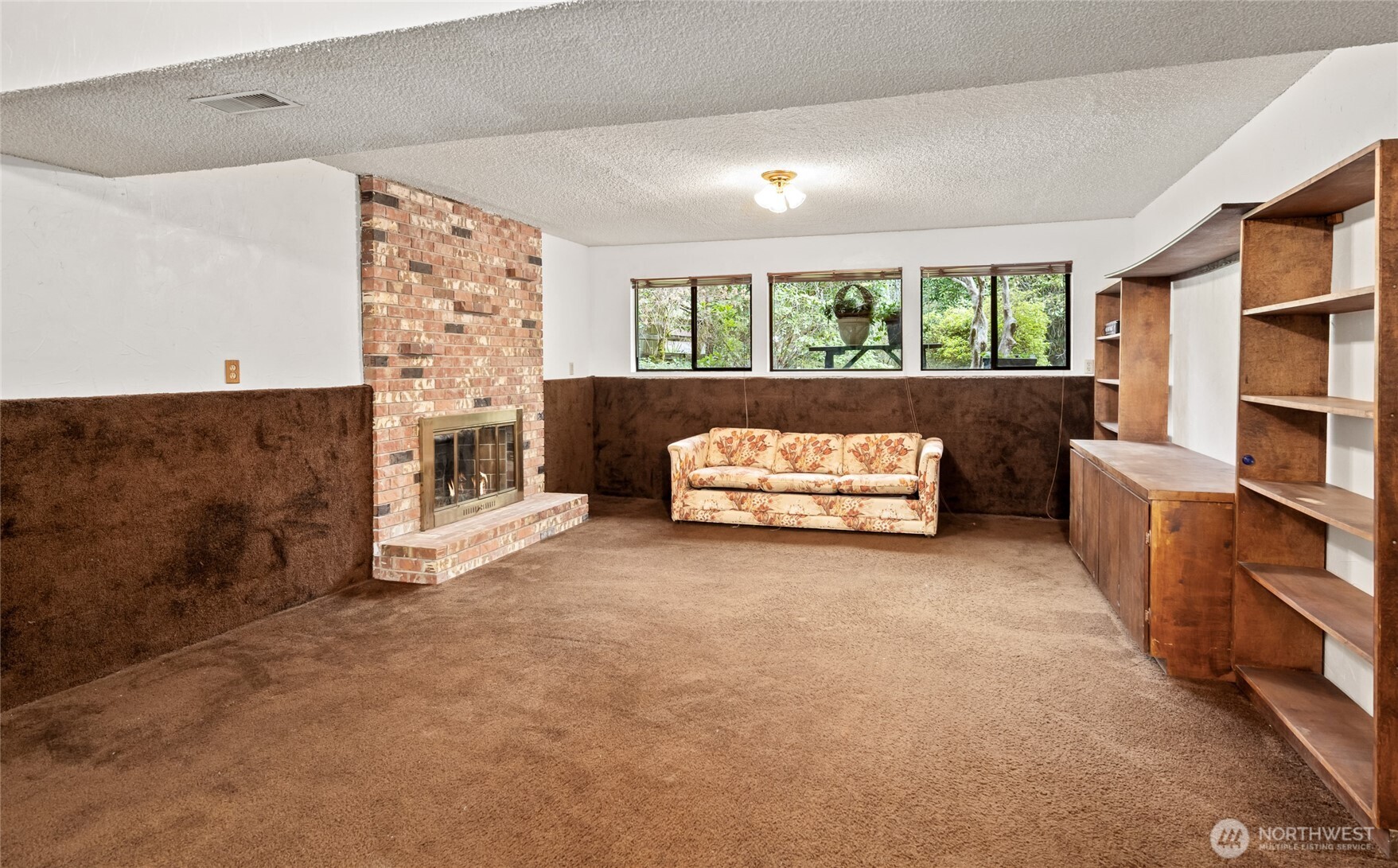 14606 60th Place West Edmonds, WA 98026 - Photo 18 of 27 a living room with furniture and a fireplace