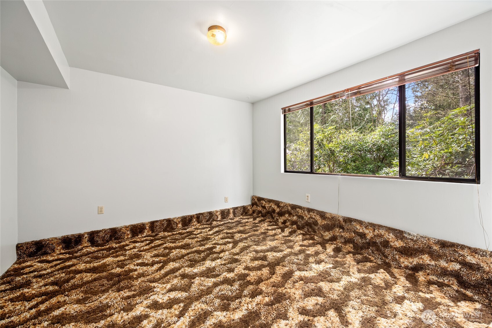 14606 60th Place West Edmonds, WA 98026 - Photo 21 of 27 a view of an empty room with a window