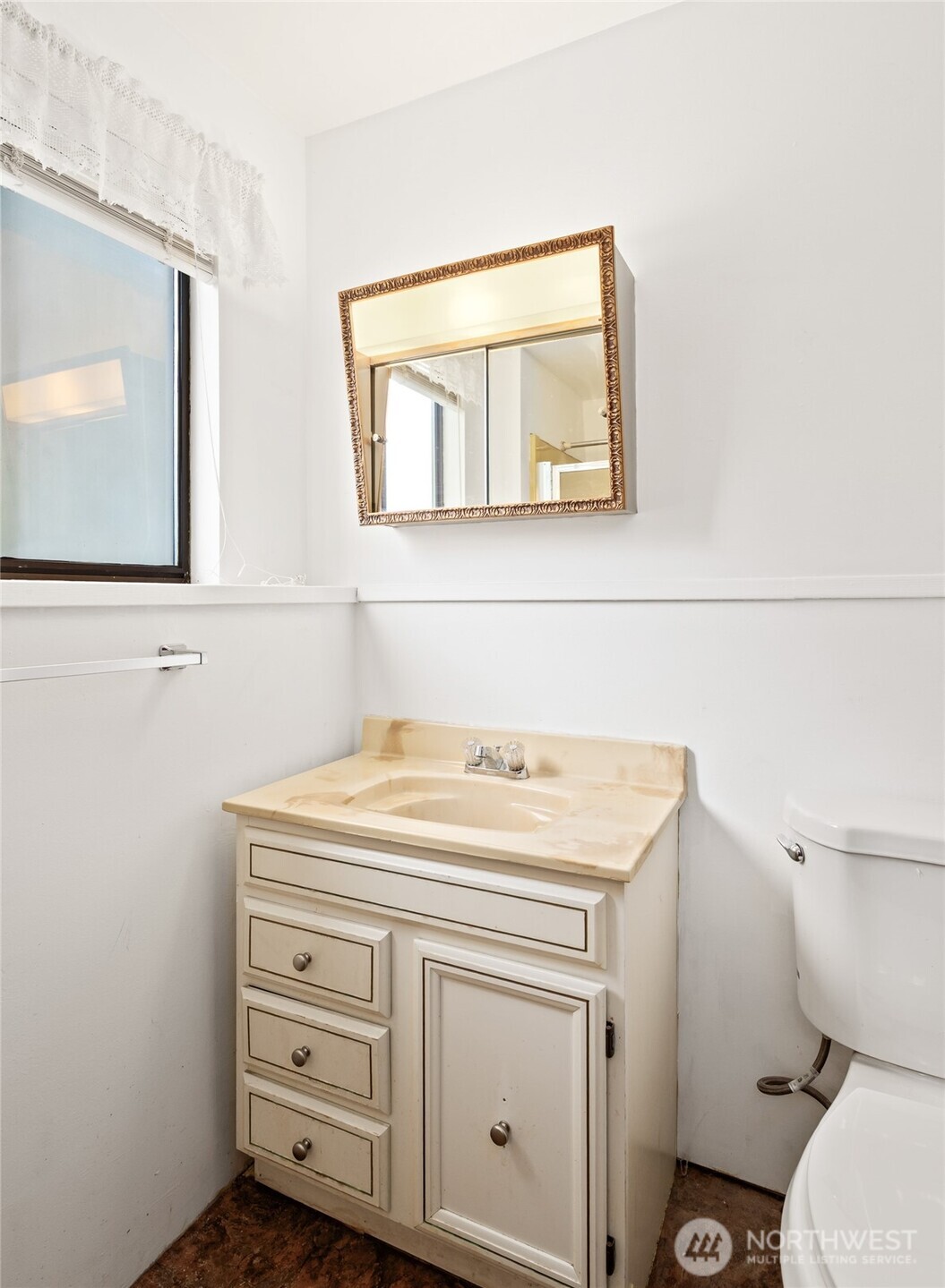 14606 60th Place West Edmonds, WA 98026 - Photo 23 of 27 a bathroom with a toilet sink and mirror