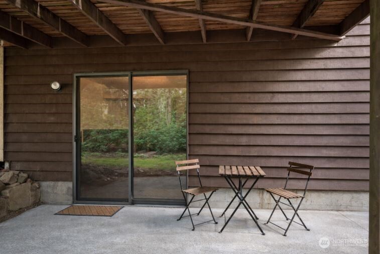 14606 60th Place West Edmonds, WA 98026 - Photo 25 of 27 a backyard of a house with table and chairs