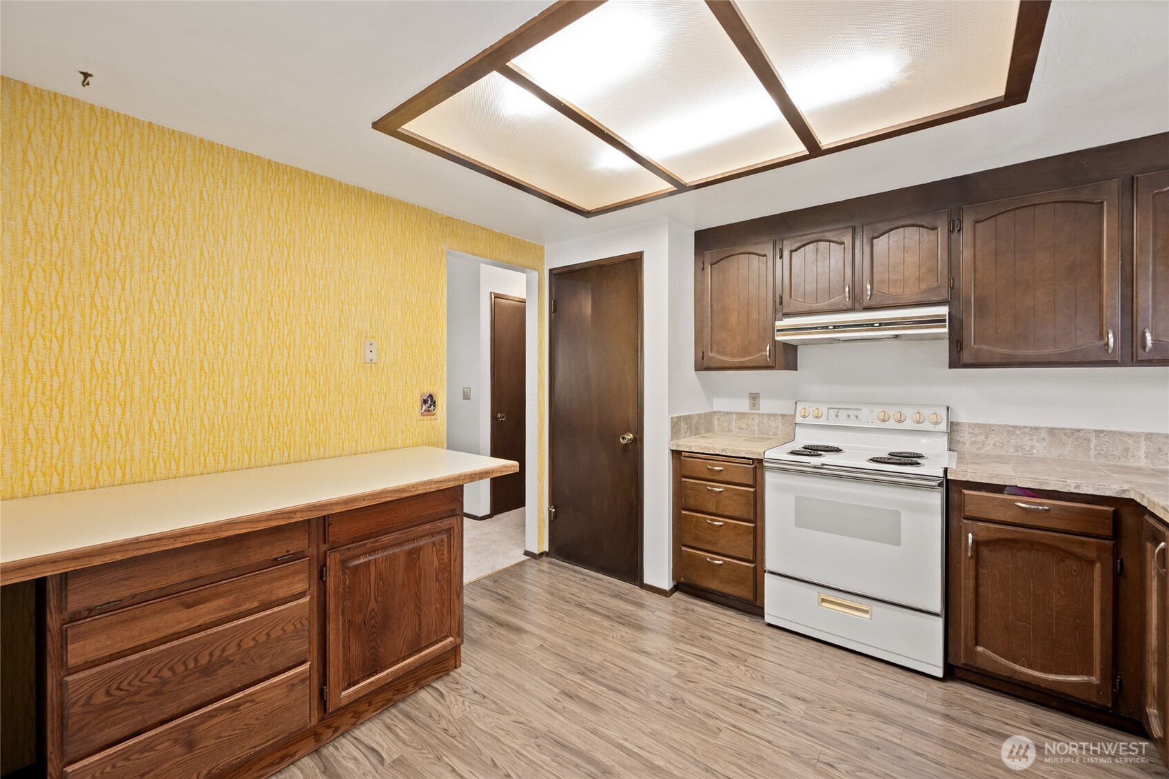 14606 60th Place West Edmonds, WA 98026 - Photo 10 of 27 a kitchen with stainless steel appliances granite countertop a stove and a refrigerator
