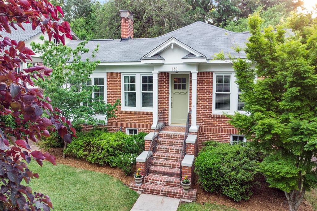 136 Ponce De Leon Court Decatur, GA 30030 - Photo 1 of 1 a front view of a house with a garden