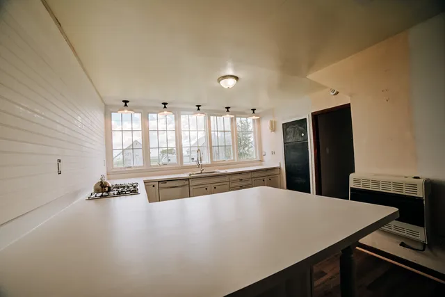 a kitchen with a sink and cabinets
