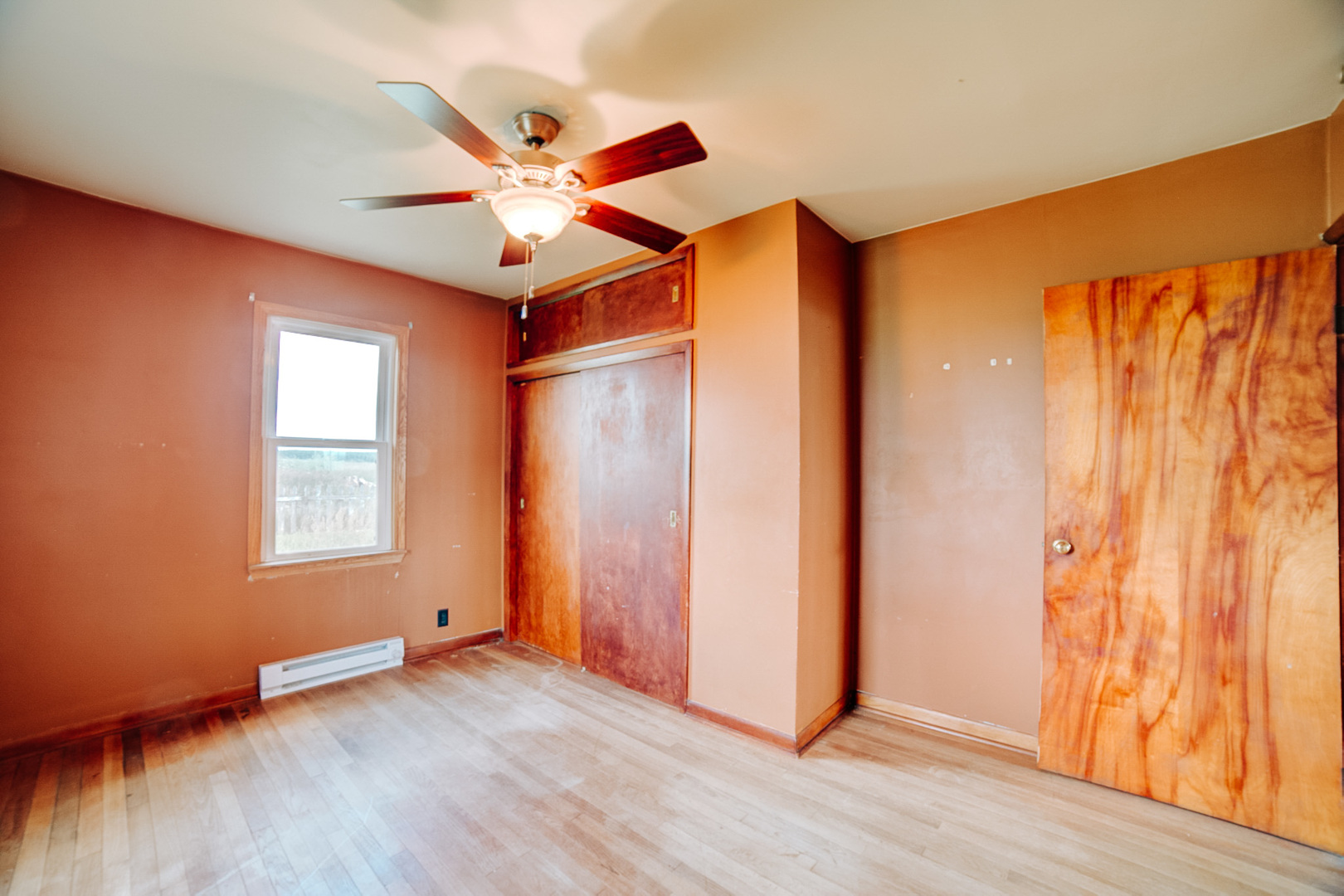 2371 North 3100 East Road Donovan, IL 60931 - Photo 33 of 45 an empty room with wooden floor fan and windows
