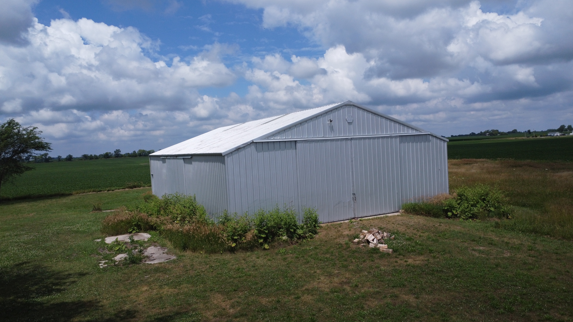 2371 North 3100 East Road Donovan, IL 60931 - Photo 8 of 45 a backyard of a house with lots of green space table and chairs