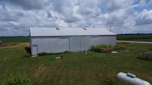a backyard of a house with lots of green space and garden view