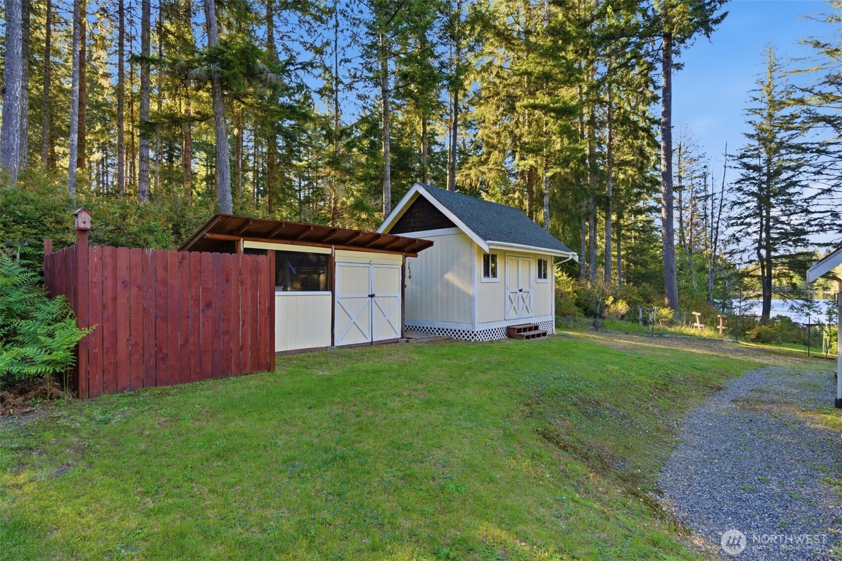 6971 Northeast Tahuya Blacksmith Road Belfair, WA 98528 - Photo 38 of 38 a front view of house with a garden